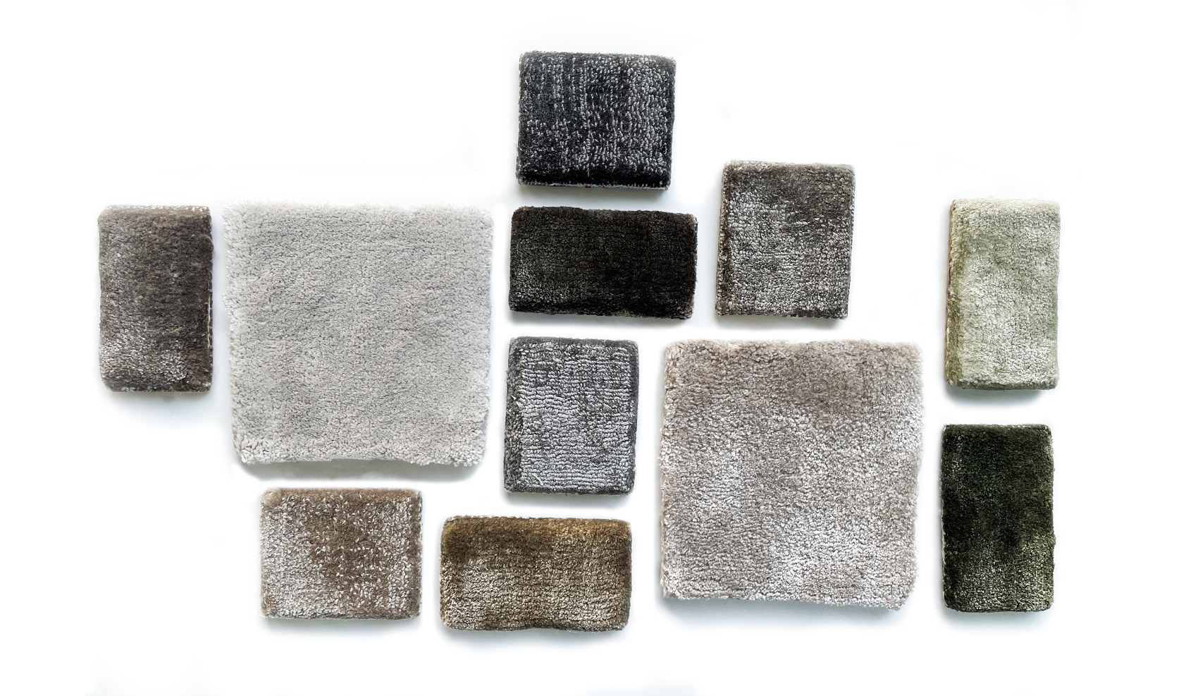 Collection of square textured tiles in various colors on a white background